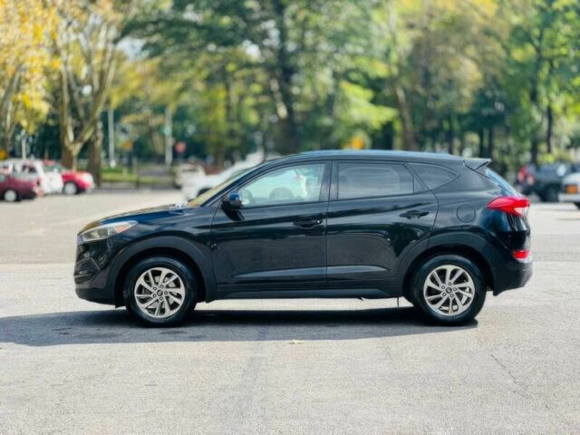 Черный Хендай Туксон, объемом двигателя 2 л и пробегом 60 тыс. км за 13500 $, фото 4 на Automoto.ua