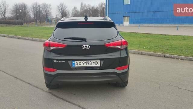 Чорний Хендай Туксон, об'ємом двигуна 2 л та пробігом 143 тис. км за 18000 $, фото 5 на Automoto.ua