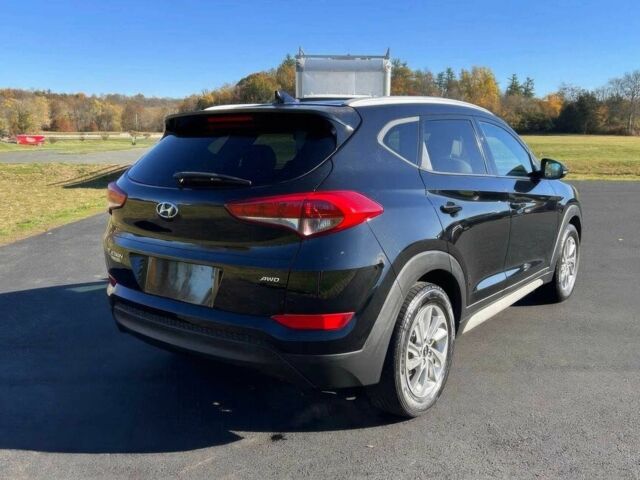 Чорний Хендай Туксон, об'ємом двигуна 2 л та пробігом 48 тис. км за 10800 $, фото 6 на Automoto.ua