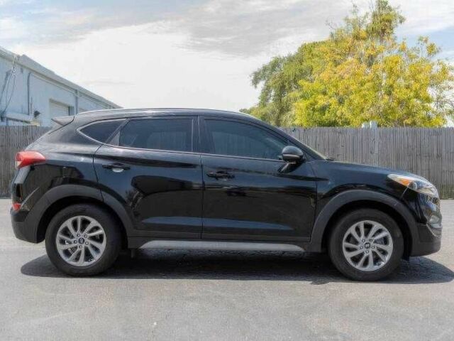 Черный Хендай Туксон, объемом двигателя 2 л и пробегом 89 тыс. км за 11200 $, фото 1 на Automoto.ua