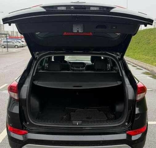 Черный Хендай Туксон, объемом двигателя 1.6 л и пробегом 65 тыс. км за 12600 $, фото 10 на Automoto.ua