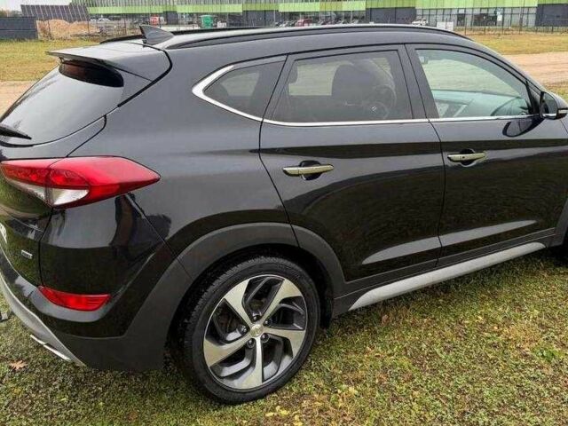 Черный Хендай Туксон, объемом двигателя 1.6 л и пробегом 65 тыс. км за 12600 $, фото 3 на Automoto.ua