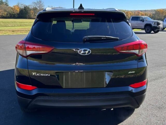 Чорний Хендай Туксон, об'ємом двигуна 2 л та пробігом 48 тис. км за 10800 $, фото 5 на Automoto.ua