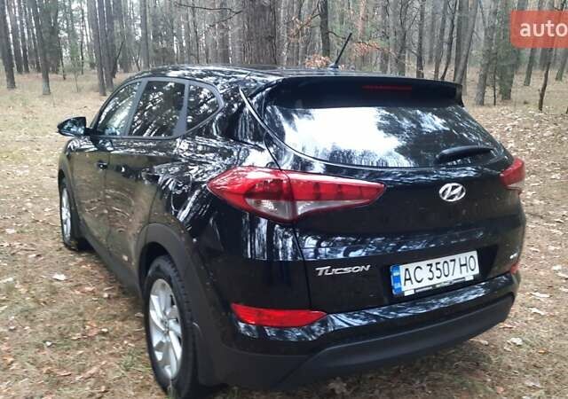 Черный Хендай Туксон, объемом двигателя 2 л и пробегом 100 тыс. км за 17200 $, фото 1 на Automoto.ua