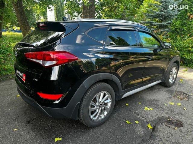 Черный Хендай Туксон, объемом двигателя 2 л и пробегом 109 тыс. км за 18490 $, фото 4 на Automoto.ua