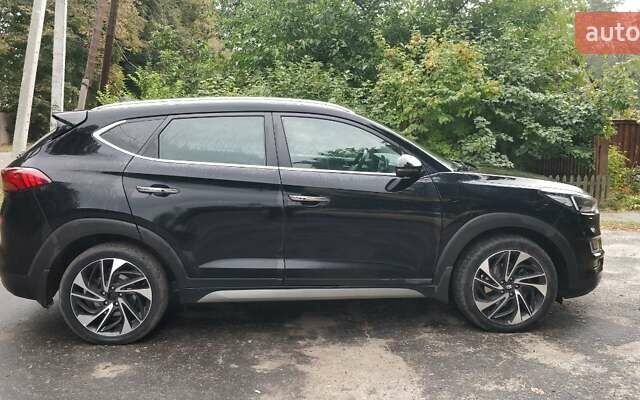 Чорний Хендай Туксон, об'ємом двигуна 2 л та пробігом 91 тис. км за 25000 $, фото 4 на Automoto.ua