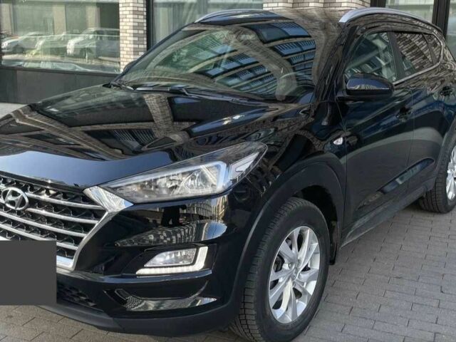 Черный Хендай Туксон, объемом двигателя 2 л и пробегом 119 тыс. км за 9900 $, фото 2 на Automoto.ua