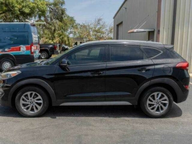 Черный Хендай Туксон, объемом двигателя 2 л и пробегом 89 тыс. км за 11200 $, фото 2 на Automoto.ua