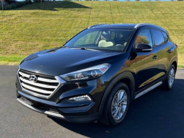 Чорний Хендай Туксон, об'ємом двигуна 2 л та пробігом 48 тис. км за 10800 $, фото 2 на Automoto.ua