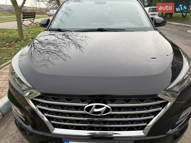 Черный Хендай Туксон, объемом двигателя 2 л и пробегом 70 тыс. км за 23000 $, фото 4 на Automoto.ua