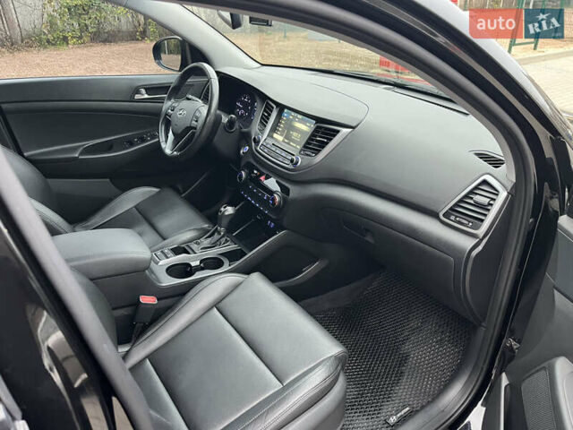 Черный Хендай Туксон, объемом двигателя 1.69 л и пробегом 134 тыс. км за 21800 $, фото 27 на Automoto.ua