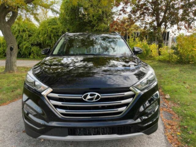 Черный Хендай Туксон, объемом двигателя 1.6 л и пробегом 34 тыс. км за 19000 $, фото 1 на Automoto.ua