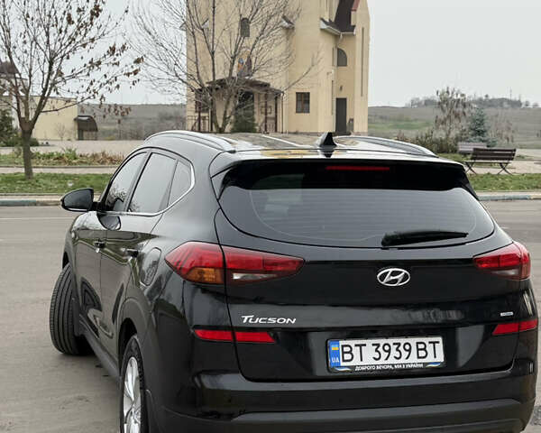 Черный Хендай Туксон, объемом двигателя 2 л и пробегом 70 тыс. км за 23000 $, фото 14 на Automoto.ua