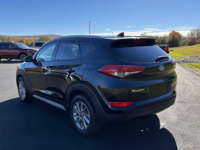 Чорний Хендай Туксон, об'ємом двигуна 2 л та пробігом 48 тис. км за 10800 $, фото 4 на Automoto.ua