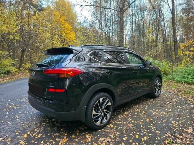 Чорний Хендай Туксон, об'ємом двигуна 2 л та пробігом 135 тис. км за 13500 $, фото 4 на Automoto.ua