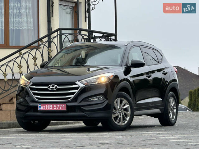 Черный Хендай Туксон, объемом двигателя 2 л и пробегом 156 тыс. км за 12800 $, фото 1 на Automoto.ua