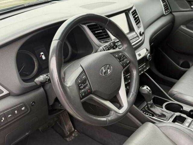 Черный Хендай Туксон, объемом двигателя 1.6 л и пробегом 65 тыс. км за 12600 $, фото 12 на Automoto.ua