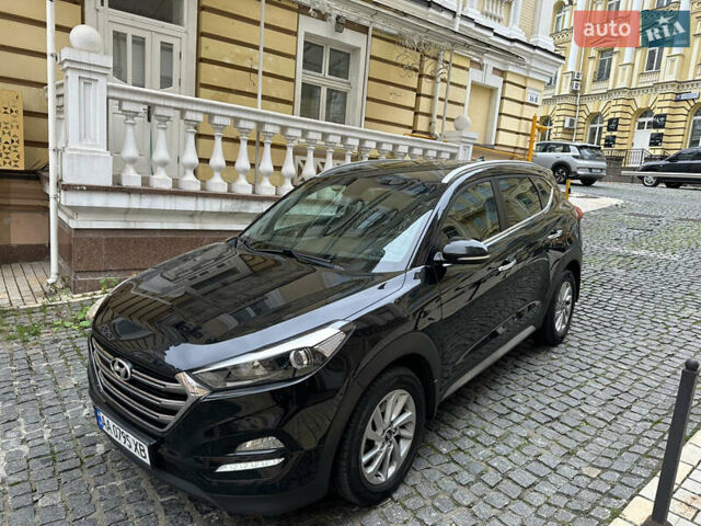 Черный Хендай Туксон, объемом двигателя 2 л и пробегом 100 тыс. км за 16900 $, фото 1 на Automoto.ua