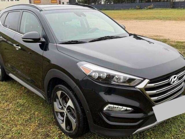 Черный Хендай Туксон, объемом двигателя 1.6 л и пробегом 65 тыс. км за 12600 $, фото 1 на Automoto.ua