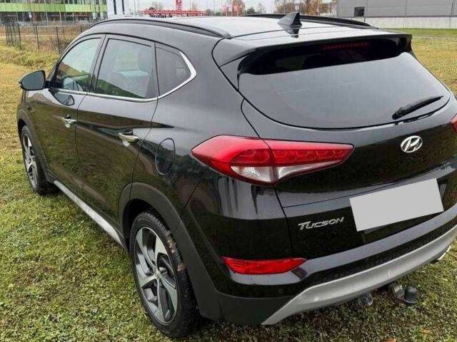 Черный Хендай Туксон, объемом двигателя 1.6 л и пробегом 65 тыс. км за 12600 $, фото 7 на Automoto.ua