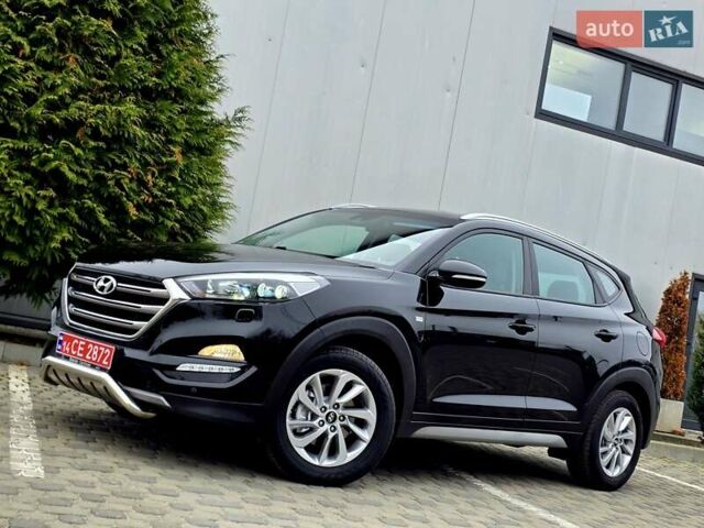 Черный Хендай Туксон, объемом двигателя 2 л и пробегом 151 тыс. км за 18950 $, фото 1 на Automoto.ua