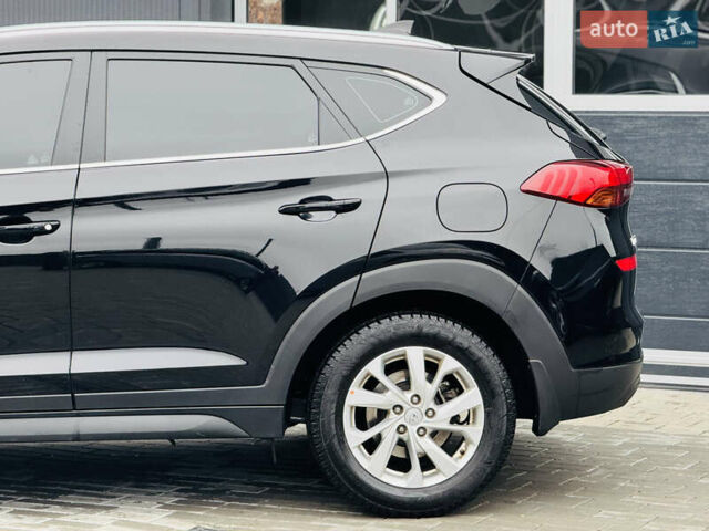 Чорний Хендай Туксон, об'ємом двигуна 2 л та пробігом 84 тис. км за 19000 $, фото 6 на Automoto.ua