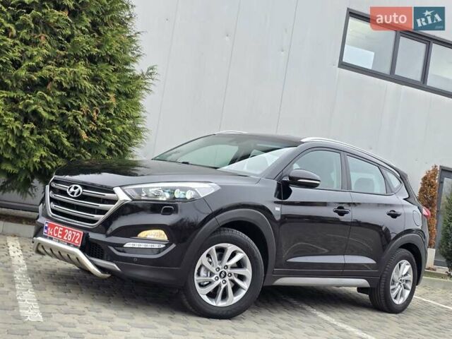 Черный Хендай Туксон, объемом двигателя 2 л и пробегом 151 тыс. км за 18950 $, фото 2 на Automoto.ua