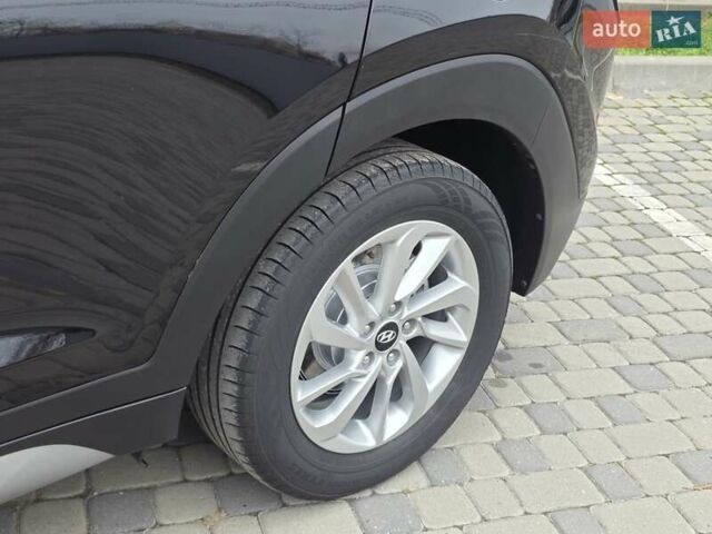 Черный Хендай Туксон, объемом двигателя 2 л и пробегом 151 тыс. км за 18950 $, фото 23 на Automoto.ua