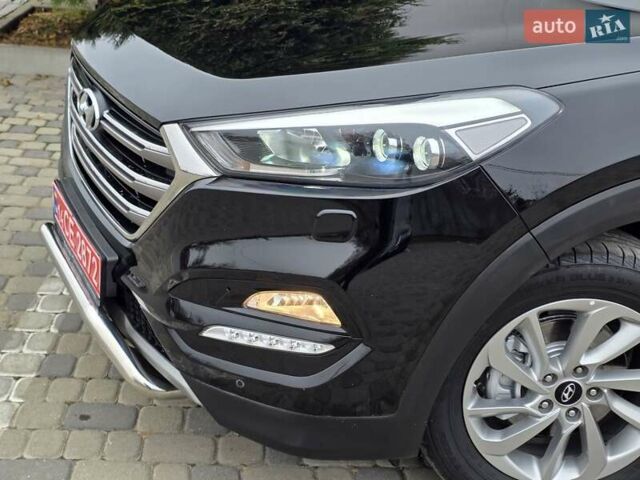 Черный Хендай Туксон, объемом двигателя 2 л и пробегом 151 тыс. км за 18950 $, фото 14 на Automoto.ua