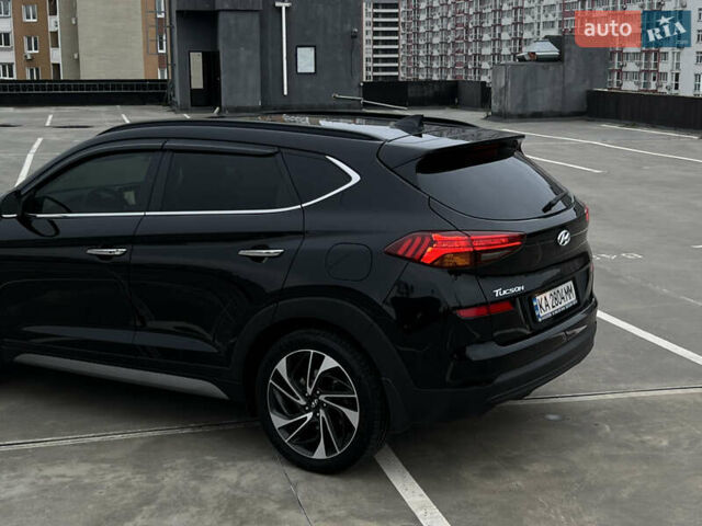 Чорний Хендай Туксон, об'ємом двигуна 2 л та пробігом 145 тис. км за 23900 $, фото 4 на Automoto.ua