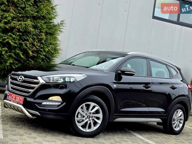 Черный Хендай Туксон, объемом двигателя 2 л и пробегом 151 тыс. км за 18950 $, фото 6 на Automoto.ua