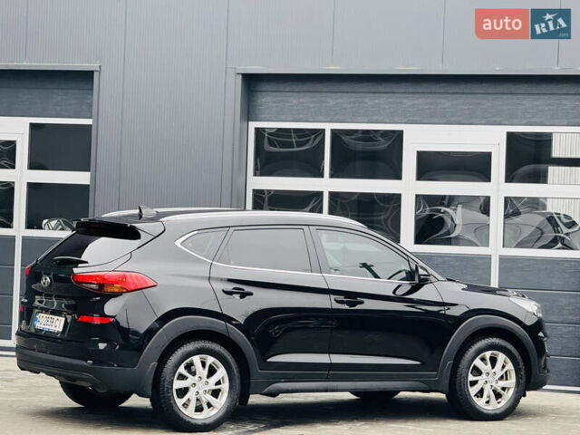 Чорний Хендай Туксон, об'ємом двигуна 2 л та пробігом 84 тис. км за 19000 $, фото 4 на Automoto.ua