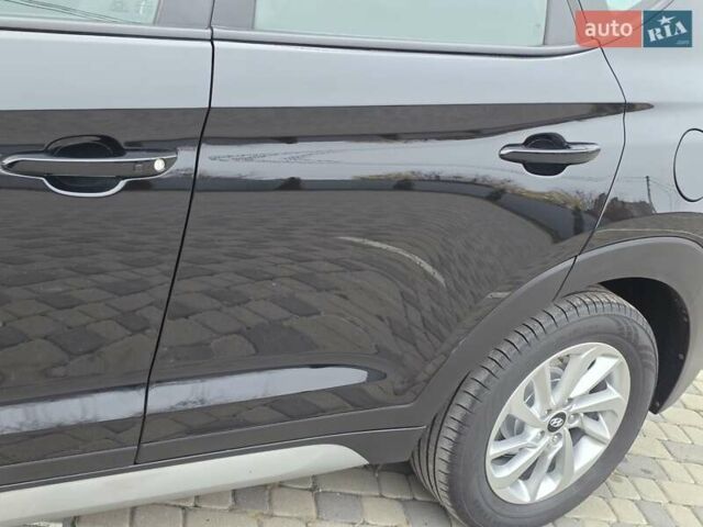 Черный Хендай Туксон, объемом двигателя 2 л и пробегом 151 тыс. км за 18950 $, фото 25 на Automoto.ua