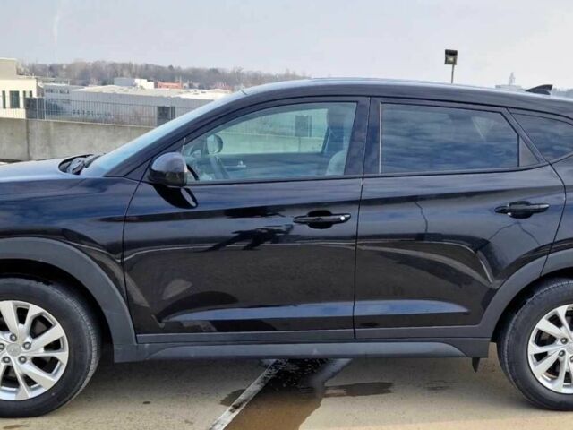 Черный Хендай Туксон, объемом двигателя 2 л и пробегом 76 тыс. км за 11200 $, фото 7 на Automoto.ua