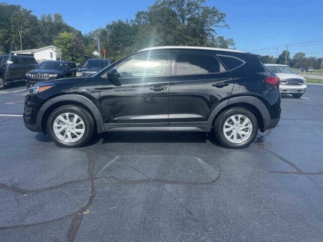 Черный Хендай Туксон, объемом двигателя 2 л и пробегом 38 тыс. км за 10400 $, фото 4 на Automoto.ua