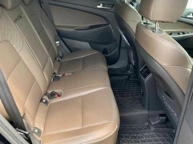 Черный Хендай Туксон, объемом двигателя 2 л и пробегом 129 тыс. км за 16500 $, фото 7 на Automoto.ua