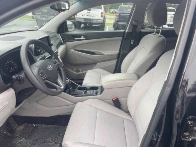 Черный Хендай Туксон, объемом двигателя 2 л и пробегом 38 тыс. км за 10400 $, фото 7 на Automoto.ua