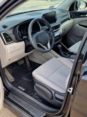 Черный Хендай Туксон, объемом двигателя 2 л и пробегом 76 тыс. км за 11200 $, фото 9 на Automoto.ua