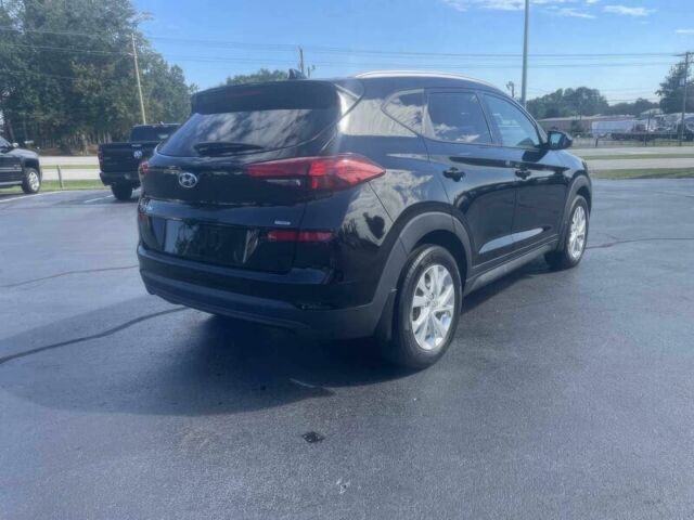 Черный Хендай Туксон, объемом двигателя 2 л и пробегом 38 тыс. км за 10400 $, фото 6 на Automoto.ua