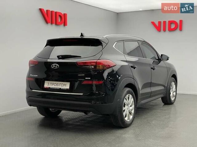 Черный Хендай Туксон, объемом двигателя 2 л и пробегом 100 тыс. км за 22424 $, фото 1 на Automoto.ua
