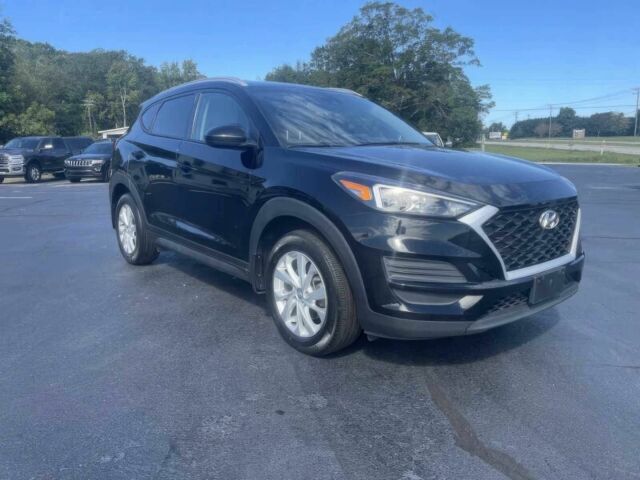 Черный Хендай Туксон, объемом двигателя 2 л и пробегом 38 тыс. км за 10400 $, фото 2 на Automoto.ua