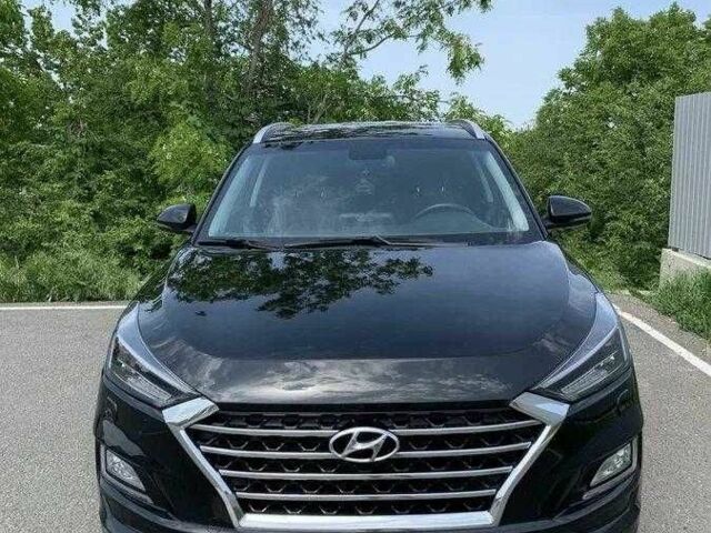 Черный Хендай Туксон, объемом двигателя 2 л и пробегом 129 тыс. км за 16500 $, фото 1 на Automoto.ua