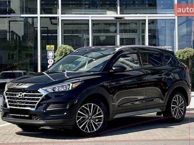 Черный Хендай Туксон, объемом двигателя 2.36 л и пробегом 53 тыс. км за 19500 $, фото 4 на Automoto.ua