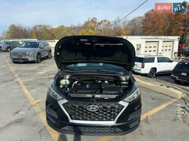 Черный Хендай Туксон, объемом двигателя 2 л и пробегом 125 тыс. км за 4300 $, фото 4 на Automoto.ua