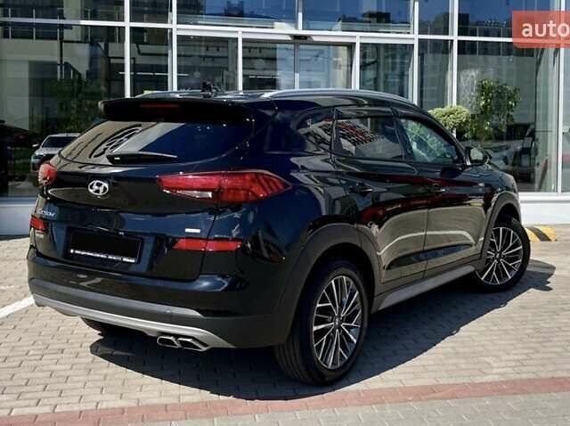 Черный Хендай Туксон, объемом двигателя 2.36 л и пробегом 53 тыс. км за 19500 $, фото 5 на Automoto.ua