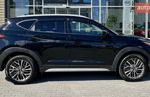Черный Хендай Туксон, объемом двигателя 2.36 л и пробегом 53 тыс. км за 19500 $, фото 2 на Automoto.ua