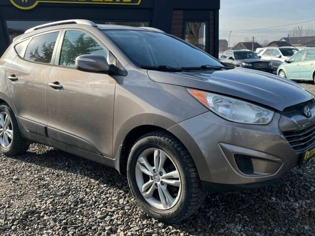 Коричневый Хендай Туксон, объемом двигателя 2.4 л и пробегом 170 тыс. км за 10700 $, фото 1 на Automoto.ua