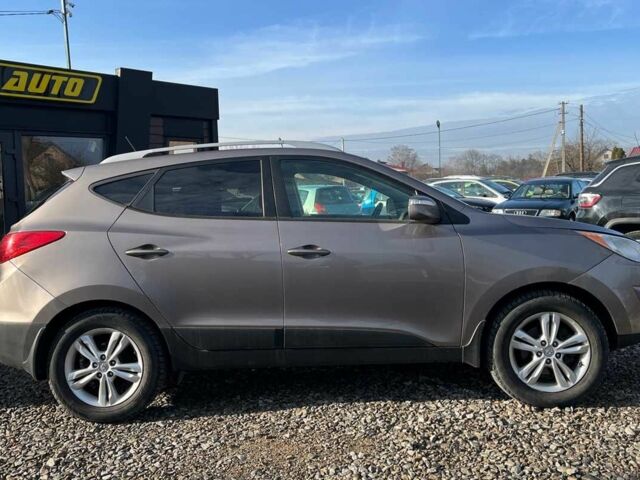 Коричневый Хендай Туксон, объемом двигателя 2.4 л и пробегом 170 тыс. км за 10700 $, фото 8 на Automoto.ua