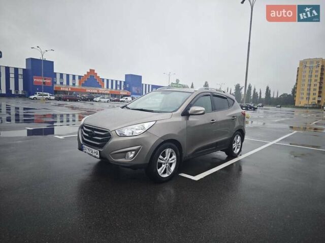 Коричневый Хендай Туксон, объемом двигателя 2.4 л и пробегом 148 тыс. км за 11700 $, фото 1 на Automoto.ua