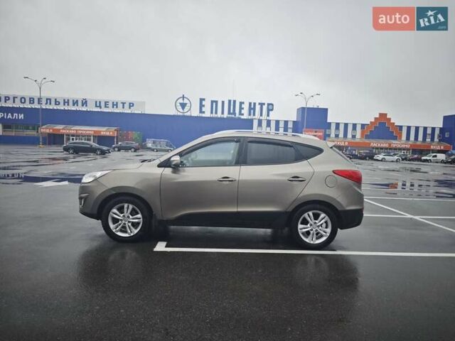 Коричневый Хендай Туксон, объемом двигателя 2.4 л и пробегом 148 тыс. км за 11700 $, фото 5 на Automoto.ua